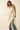 Tiks Layering Midi Dress ivory lace dress side profile showing soft side slit and airy fabric movement.