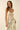 Tiks Layering Midi Dress ivory lace midi dress styled over relaxed denim jeans showing layering versatility and bohemian silhouette.