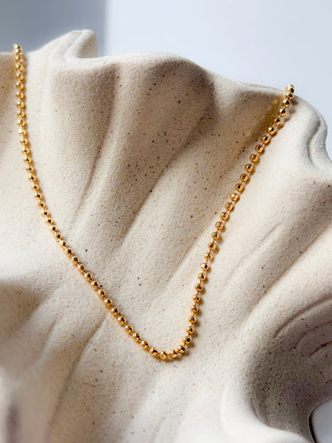 Together Necklace by Matte, gold plated ball chain on ceramic surface