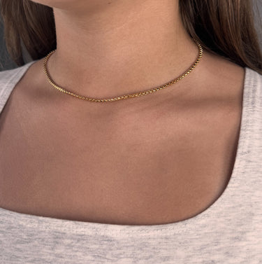 Model wearing Union gold filled chain necklace close-up