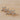 Gold triple star hair clip with crystal accents on wood background – Ventura Hair Clip by Matte.