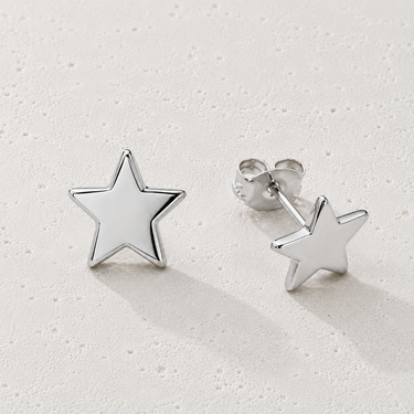 Vira Stud Earrings by Matte in polished silver featuring minimalist star-shaped studs with post backs, styled on a soft neutral background.