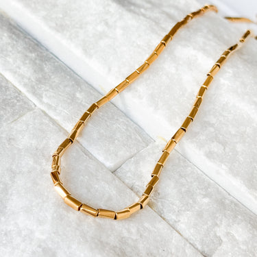 Willow Necklace by Matte, gold filled rectangular link chain on marble surface
