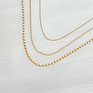 Yara Necklace Set 3 by Matte—three gold-plated chains (14, 16 & 18″) with 2″ extender on neutral background