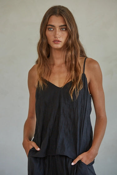 Zia Top black camisole with relaxed fit and spaghetti strap design.