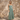 Matte Maxi Dresses collection image – model wearing a sage green maxi dress with ivory tie straps in front of a textured beige stone wall in warm natural sunlight