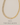 old Alderic necklace with baguette-cut crystal detailing and link chain styled on neutral beige background with text All Necklaces in elegant gray serif font – Matte Jewelry Collection