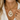 Matte Pendant Necklaces collection image featuring a close-up of a model wearing a chunky gold chain necklace with a white teardrop pendant and crystal center, styled with a white linen shirt in warm natural light.