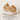 Gold teardrop stud earrings displayed on soft white linen fabric with neutral background – Just Dropped Earrings Collection by Matte