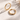 Matte Hoop Collection – polished gold hoop earrings on white textured stone background with soft natural shadows