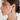 Silver Ribbed Teardrop Statement Earrings worn on model in side-profile close-up, featuring a sculptural polished silver finish and textured ridged design.
