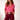 Matte New Arrivals collection image featuring a model wearing a hot pink blouse and burgundy pants styled with a woven belt on a clean studio background.
