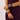 Model wearing a colorful stack of statement bracelets in mixed shapes and bold colors from Matte.