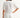 Woman wearing a white blouse and pants against a white background