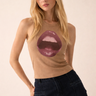 Abar Top fitted taupe ribbed tank top with bold lip graphic on front, styled on model with dark denim jeans against warm neutral studio background.