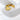 Gold double-heart open ring on white marble surface – Adallet Ring by Matte.
