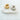 Two Adelaide ear cuffs, one gold-colored and one silver-colored, placed side by side on a white surface.