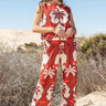Akiabara Set worn by model, front view, red sleeveless top with matching wide-leg pants and palm-inspired print