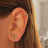 Gold plated ear cuff on models ear