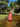 Alba Cover Up lightweight coral maxi cover up dress worn in shallow river natural outdoor setting full length front view