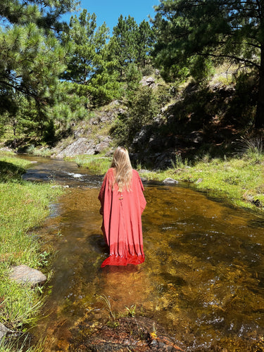 Alba Cover Up coral maxi beach cover up standing in water showing relaxed silhouette and airy drape
