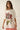 Alina Tee oversized floral graphic tee in cream featuring large red flower and butterfly detail, styled as a loose fit t-shirt dress look with relaxed silhouette and casual effortless vibe.