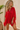 Amirot Tunic Cover up in solid red with a loose, flowy silhouette, featuring a deep V neckline, wide draped sleeves, and lightweight fabric worn as a beach cover-up