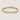 Gold bezel tennis bracelet with round clear stones, polished silver finish, secure clasp closure, and minimalist luxury jewelry styling on a warm light gray background.
