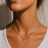 Arin Necklace delicate gold chain with tiny zirconia pendant, minimalist dainty necklace worn on neck with subtle sparkle and polished finish.