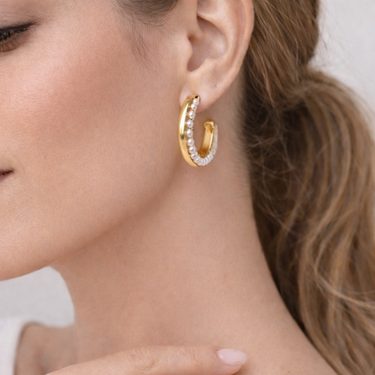Pearl Gold Hoop Earrings on model ear, gold hoop with single row of white pearls, editorial close-up