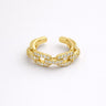 Astromellia Ring gold pavé chain link open ring with interlocking bands and shimmering stones modern adjustable statement ring on neutral background.