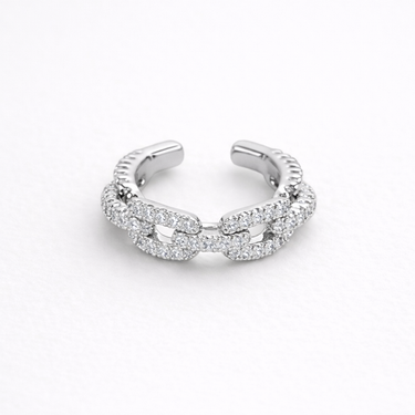 Astromellia Ring silver pavé chain link open ring with interlocking bands and shimmering stones modern adjustable statement ring on neutral background.