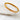 Auric gold-plated bangle bracelet with geometric texture.