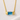 Austin Necklace close-up showing faceted blue bar pendant on gold chain.