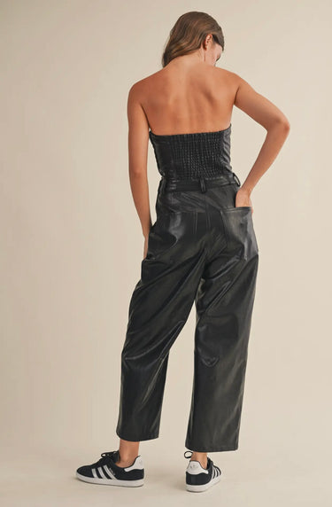 Back view of the Melina strapless jumpsuit showing relaxed straight-leg fit.