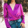  The bodysuit has a deep V-neckline and a flattering wrap design that creates a stylish cross-over effect at the chest.