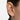 Bone Ear Cuff in polished gold with a fluid organic silhouette, styled on ear as a modern sculptural ear cuff featuring smooth molten curves and a sleek high-shine finish.
