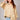 Bornandt Blouse worn by model, front view, showing button-front design and soft structured shape, tucked into jeans.