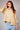 Bornandt Blouse worn by model, front view, showing button-front design and soft structured shape, tucked into jeans.