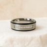 Silver ring with embedded zirconia stones displayed on neutral stone background – Brillance Ring by Matte