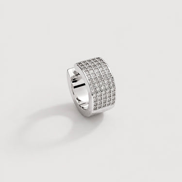 Cali Ear Cuff in polished silver featuring a wide band silhouette covered in rows of sparkling pavé crystals, designed as a bold statement ear cuff on a clean neutral background.