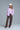 Pink and white striped button-down shirt with embroidered red heart detail on the chest, shown on model with relaxed fit — Cayana Shirt by Matte.
