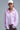 Pink and white striped button-down shirt with embroidered red heart detail on the chest, shown on model with relaxed fit — Cayana Shirt by Matte.
