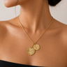 Ceke Necklace gold layered charm necklace worn on neck with coin pendant and heart charm, delicate chain and warm gold tone