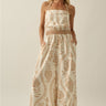 Ciguu Printed Halter Jumpsuit front view showing wide leg silhouette and neutral resort print