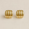 Clarté Stud Earrings, gold ribbed stud earrings with stacked band design and polished mirror finish, photographed on white linen background with soft editorial lighting
