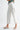 Clea Pant white cropped cotton pants with eyelet embroidery side view on model.