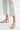 Clea Pant white embroidered cropped pants close-up of hem and side eyelet detail.