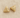 Gold sculpted triangle huggie earrings with cutout detail on linen backdrop, Colette Huggie Earrings.