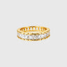 Darsy Ring gold eternity band with baguette-cut stones on silver surface